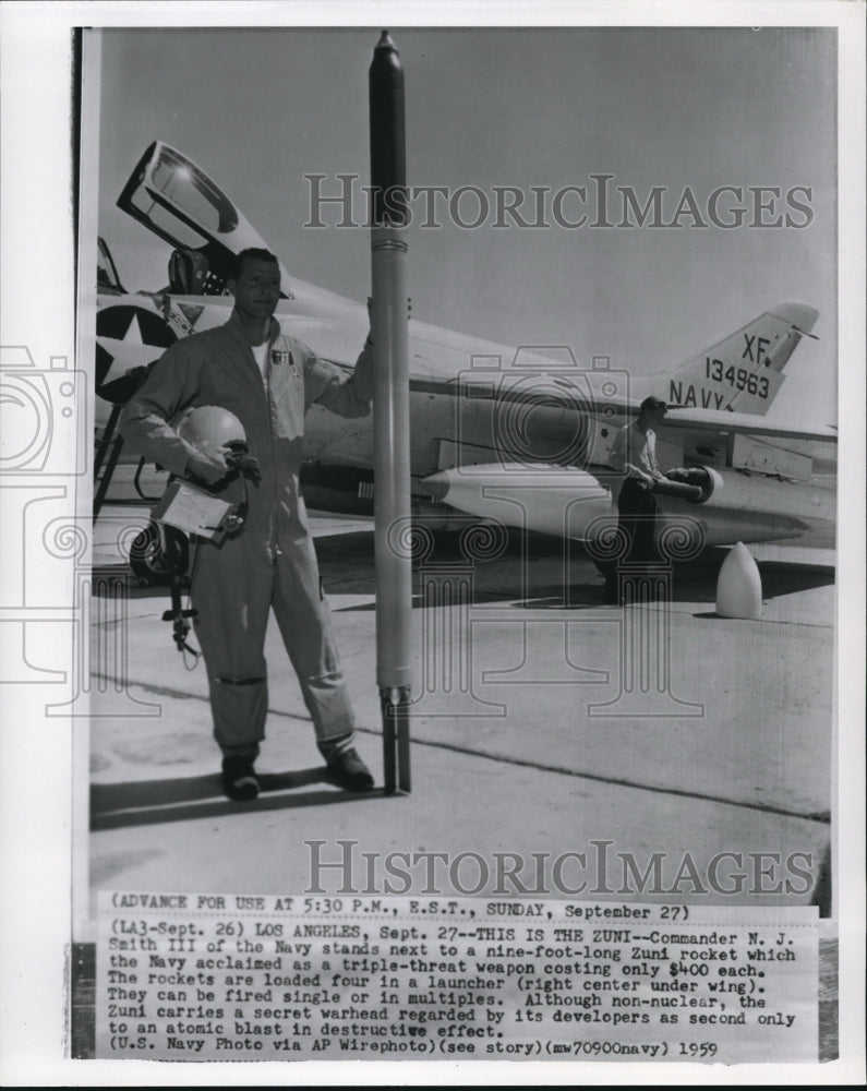 1959 Commander Smith III of the Navy with the Zuni rocket - Historic Images