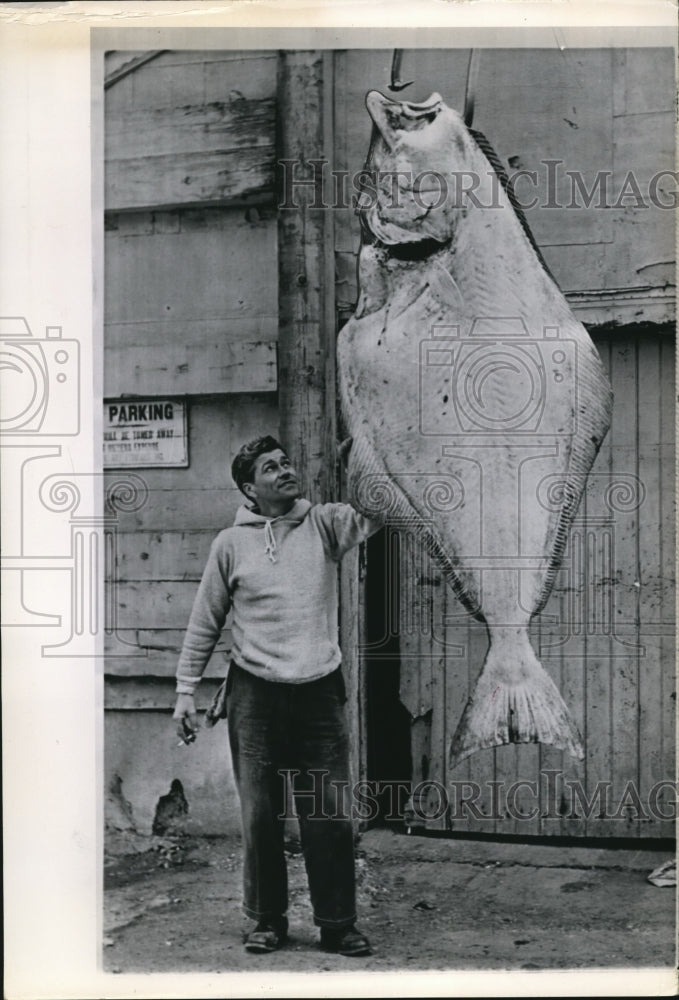 1965 Press Photo Herbie Dubois with the 40 pounds halibut he caught - Historic Images