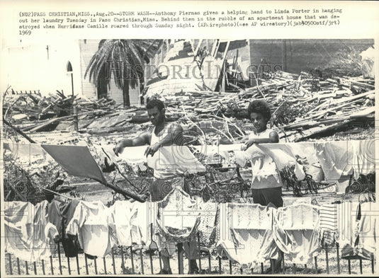 1969 Anthony Piernan gives a helping hand to Linda Porter in hanging - Historic Images
