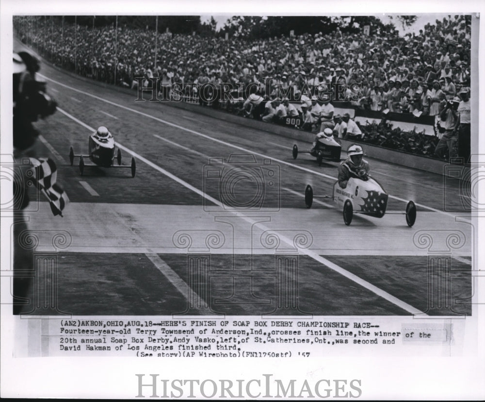 1957 Press Photo 14 year old Terry Townsend crosses finish line, the winner of - Historic Images