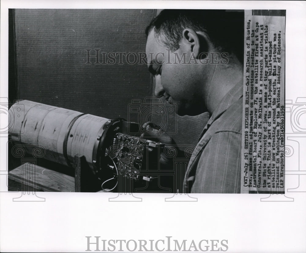 1958 Press Photo Carl McIlwan makes the final adjustments on Explorer IV - Historic Images