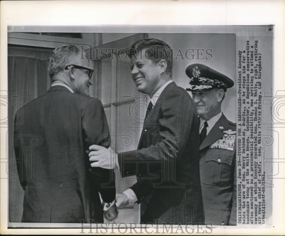 1961 Press Photo Pres. Kennedy handshakes with Sen. Goldwater at White House - Historic Images