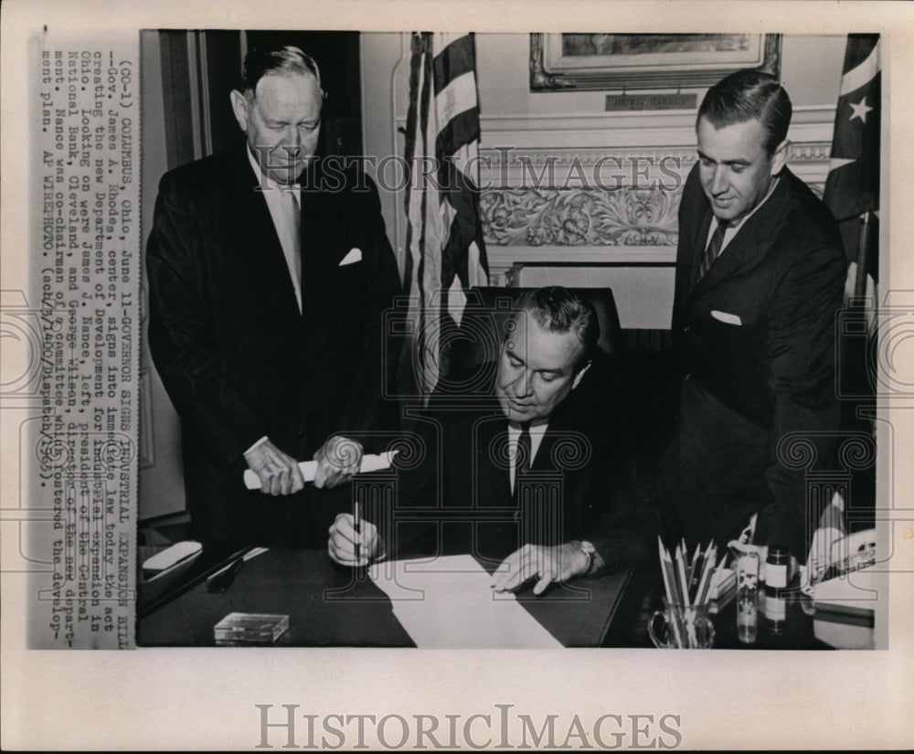 1963 Press Photo Gov. Rhodes signs Indrustrial expansion billi in Ohio - Historic Images