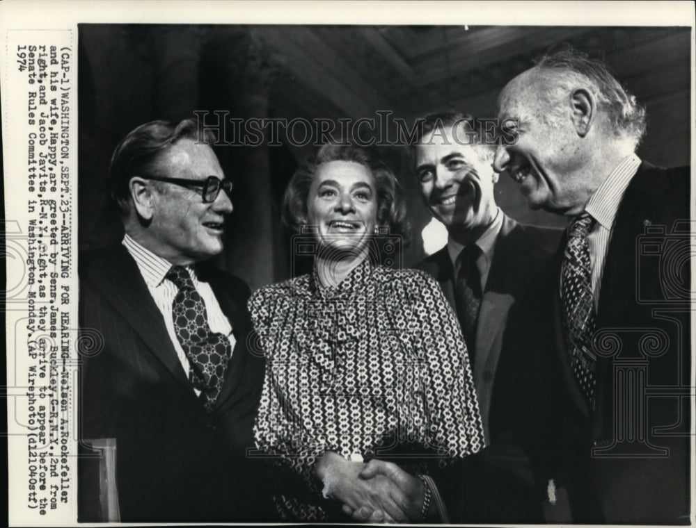 1974 Press Photo Nelson A. Rockefeller and his wife, are greeted by Sen. James - Historic Images
