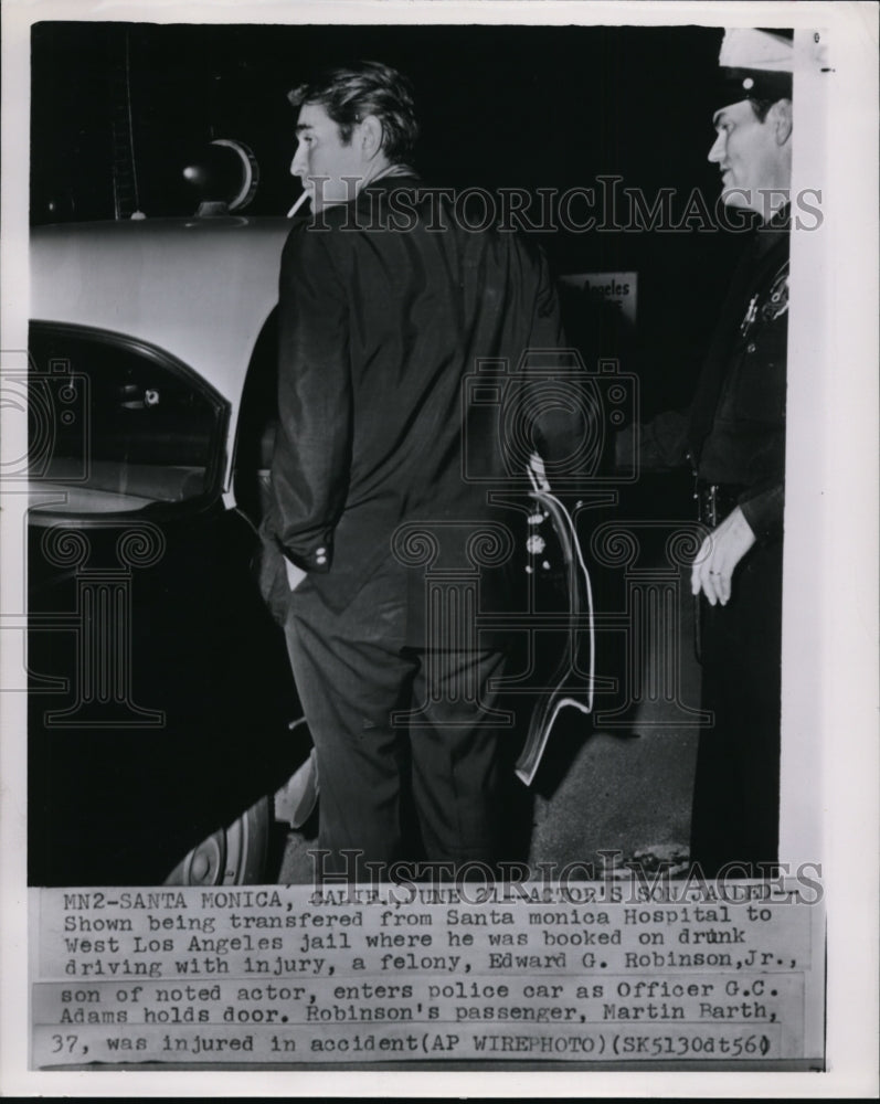 1956 Press Photo Edward Robinson Jr Enters Police Car - Historic Images