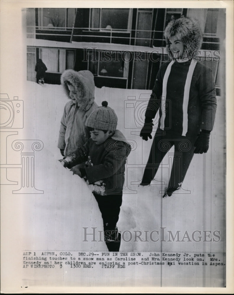 1965 Press Photo John Kennedy Jr Puts Finishing Touches on Snowman - Historic Images