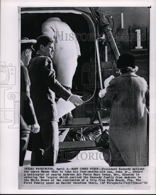 1961 Press Photo Pres. Kennedy take his son John Jr. aboard the Helicopter. - Historic Images