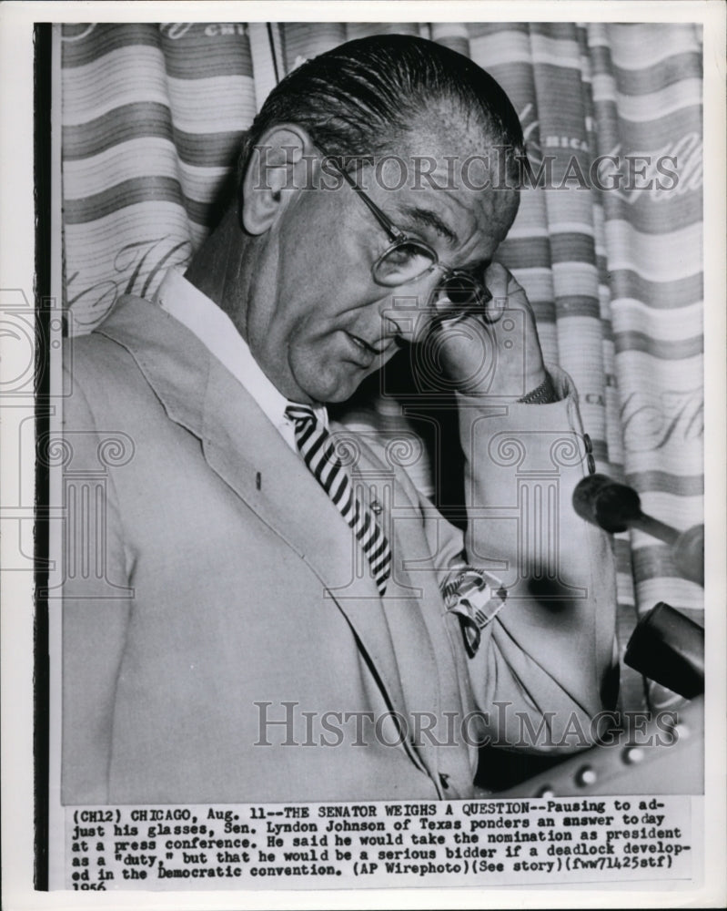 1956 Press Photo Sen. Johnson ponders an answer at a press conference - Historic Images