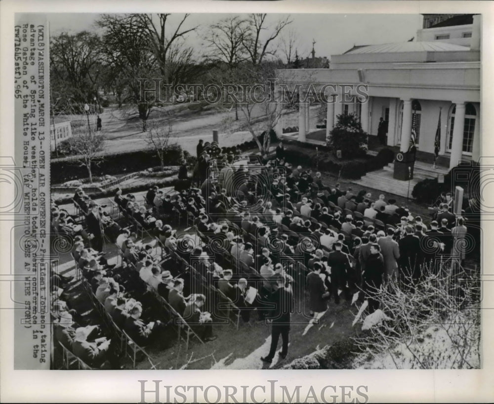 1965 President Johnson, taking advantage of Spring like weather - Historic Images