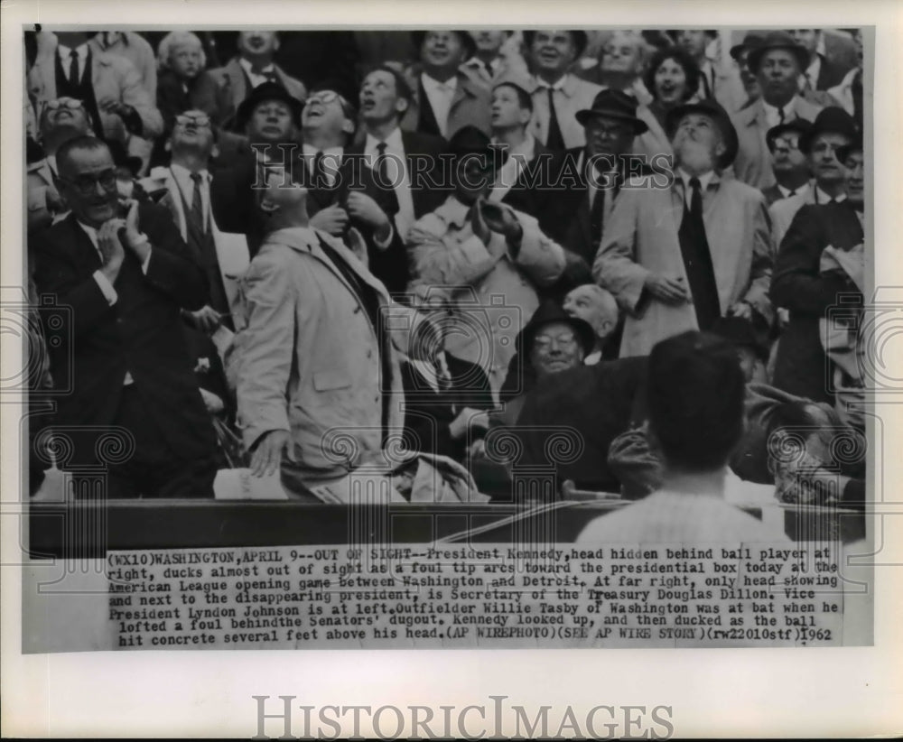 1962 Press Photo Pres. Kennedy ducks as foul tip arcs toward the box - Historic Images