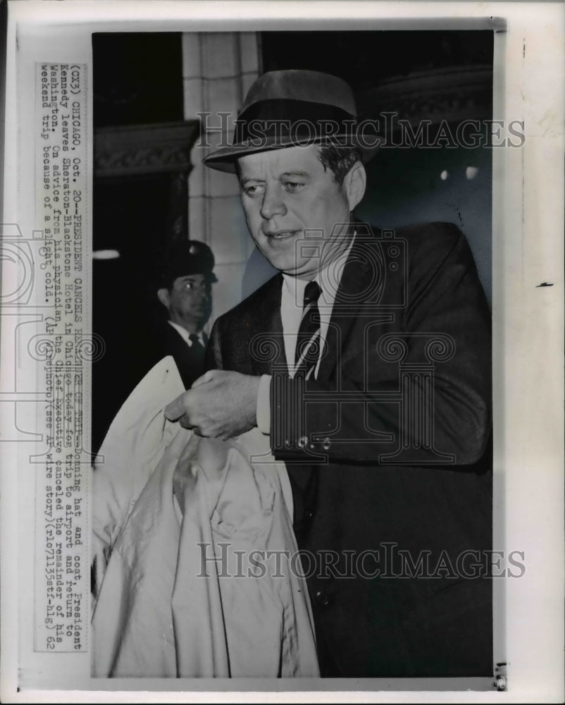 1962 Press Photo Donning hat and coat, President Kennedy leaves Sheraton- - Historic Images