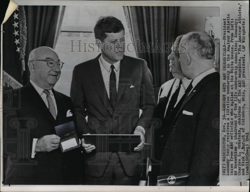 1961 Press Photo Pres.Kennedy gets AAU credentials from officials at White House - Historic Images
