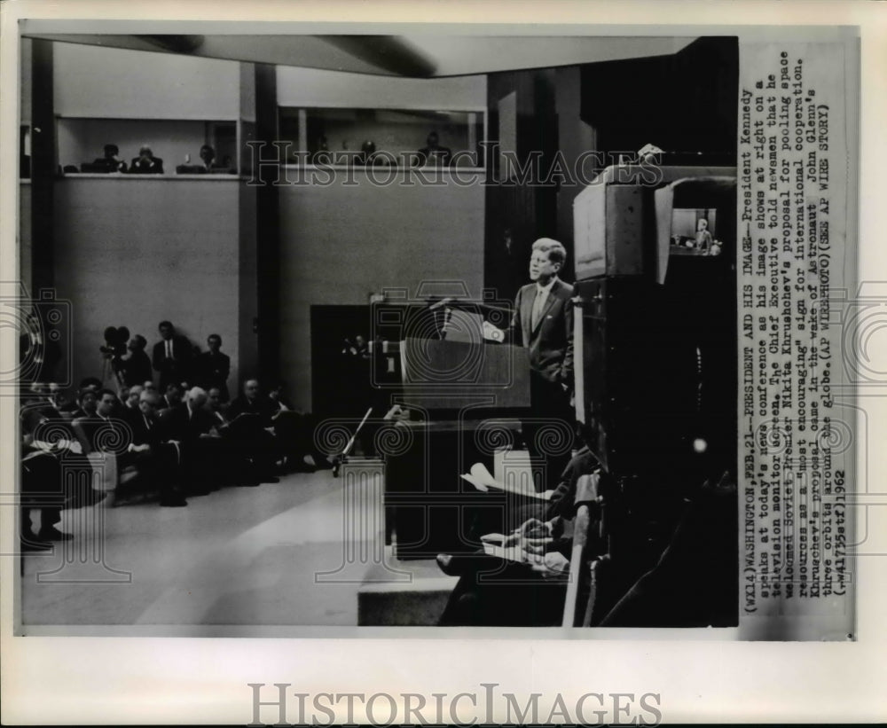 1962 Wire Photo Pres. Kennedy speaks at news conference on television monitor - Historic Images