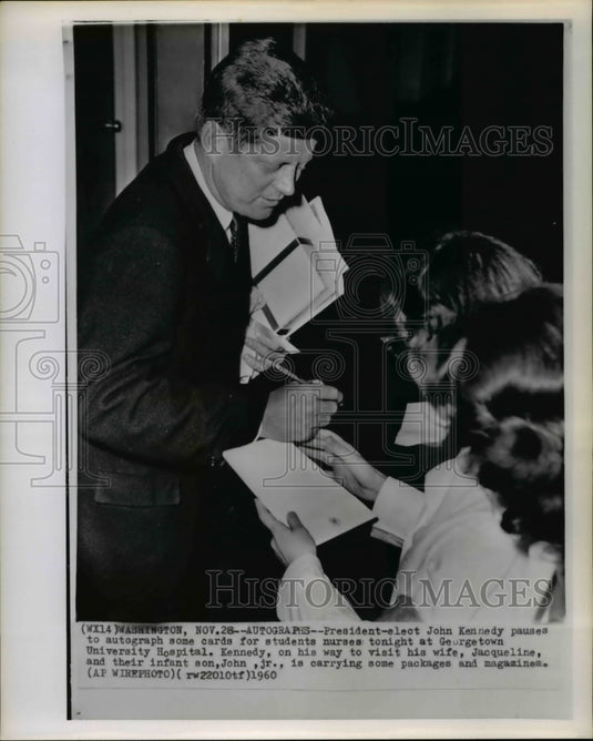 1960 Press Photo Kennedy autograph for students at Georgetown University Hotel - Historic Images