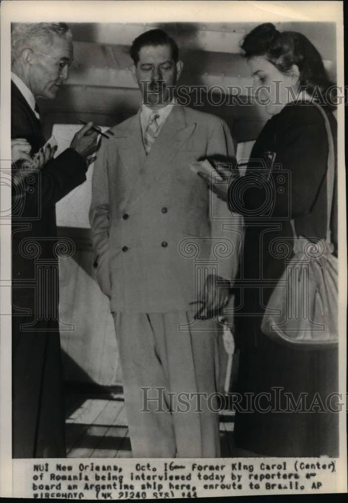 1944 Press Photo Former King Carol of Romania being interviewed by reporters on - Historic Images