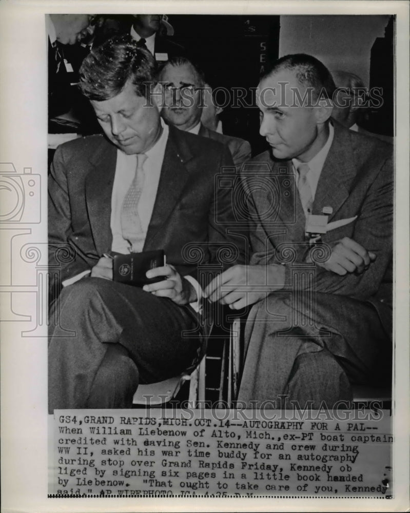 1960 Press Photo  Sen Kennedy Signing A Book Handed By William Liebenow - Historic Images