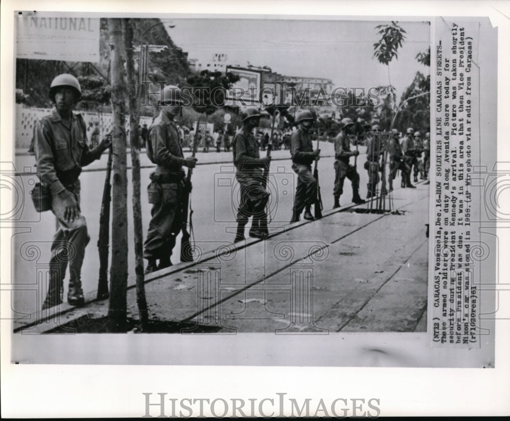 1961 Press Photo Armed soldiers line Carcas Streets for Pres Kennedy security - Historic Images