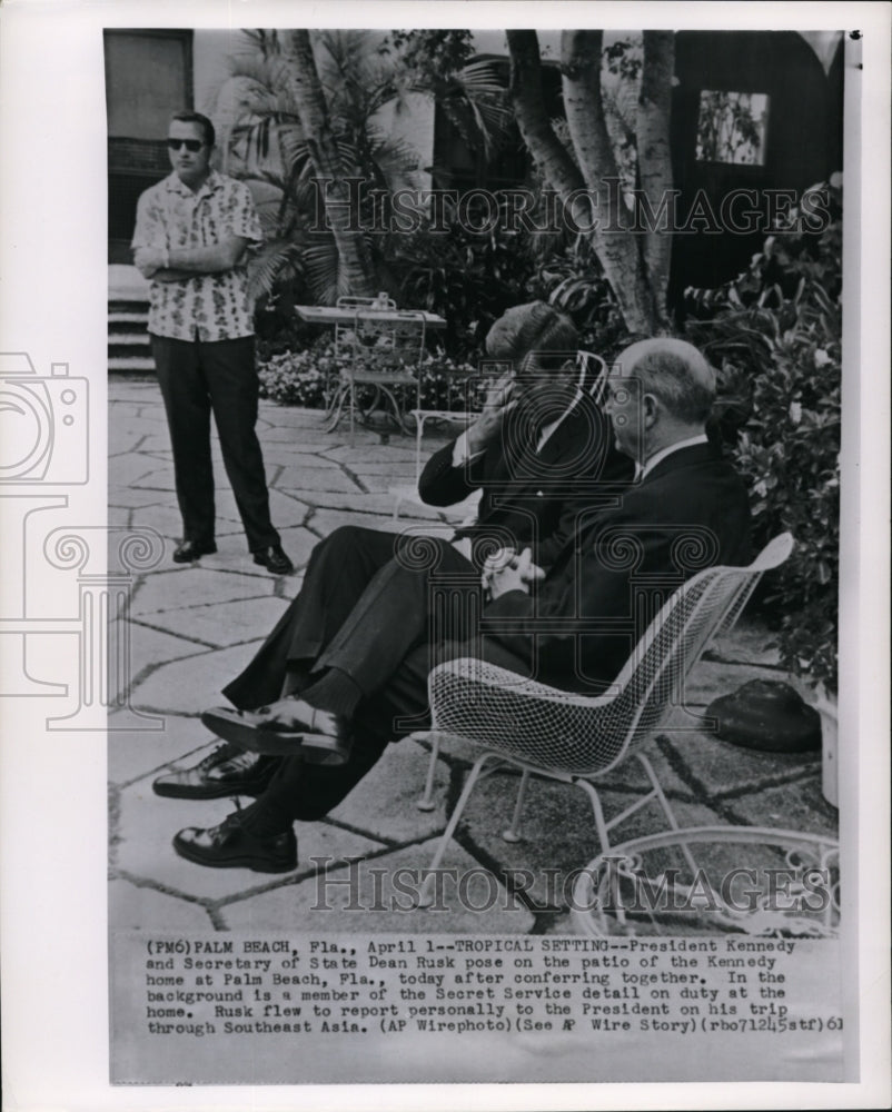 1961 Wire Photo Pres. Kennedy and Sec. of State Dean Rusk pose on a patio - Historic Images