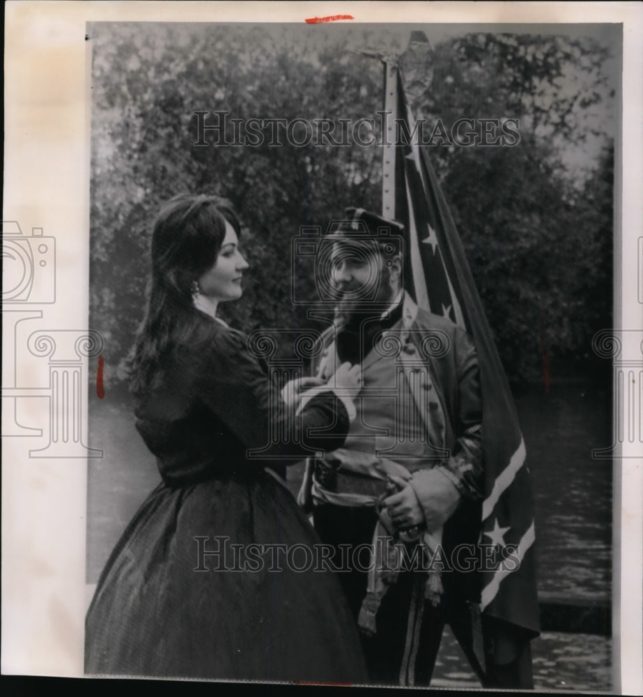 1963 Press Photo Marcus Hinton has his uniform adjusted by his wife, Cynthia - Historic Images