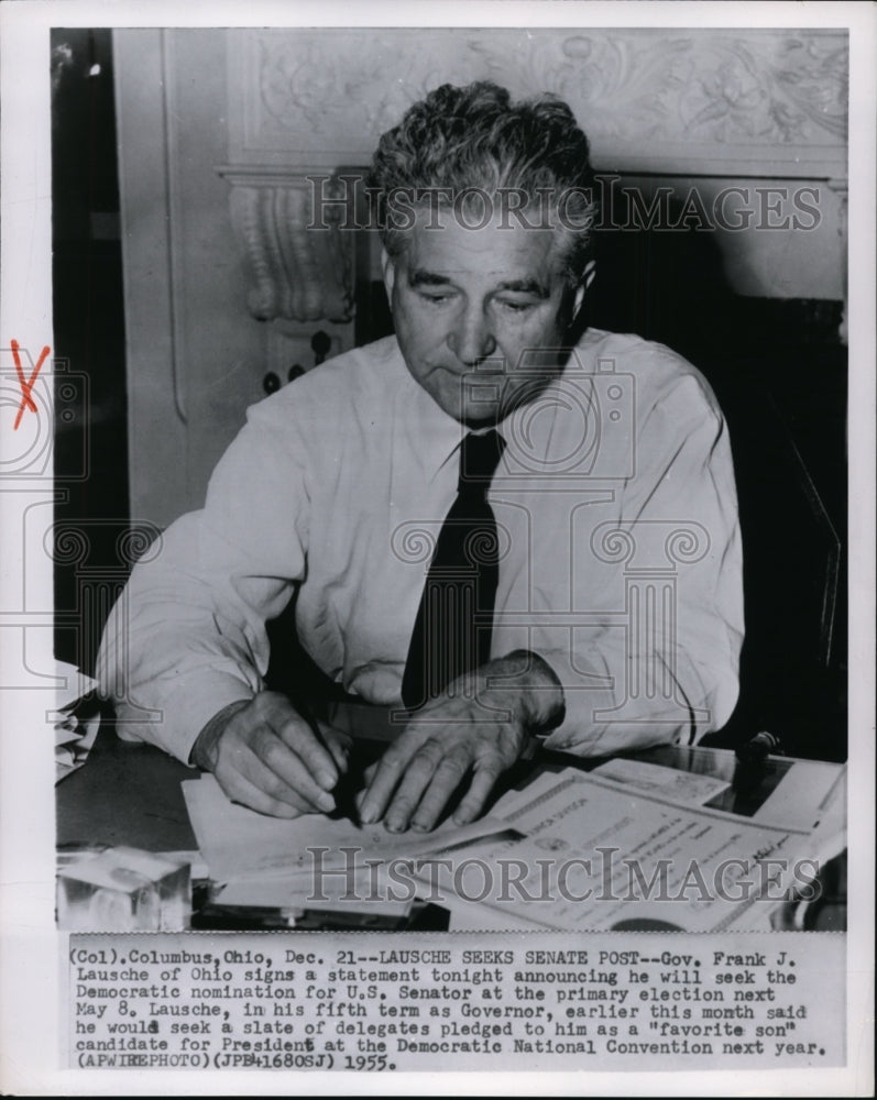 1955 Press Photo Gov. Frank J. Lausche of Ohio signs a statement announcing he - Historic Images