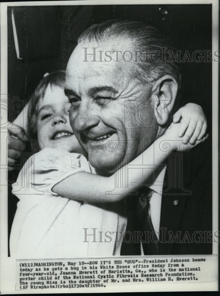 1966 Press Photo Pres Johnson beams as he gets a hug in his White House Office - Historic Images