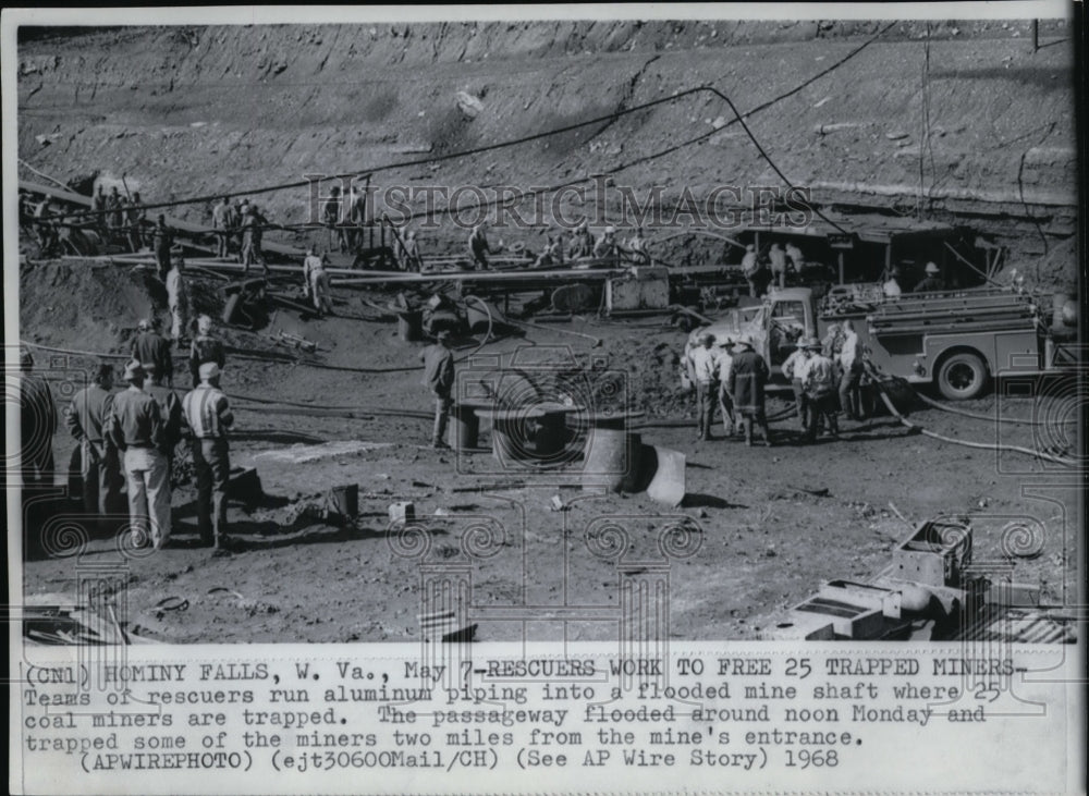 1968 Press Photo Rescuers run aluminum piping into flood mine to free 25 trapped - Historic Images