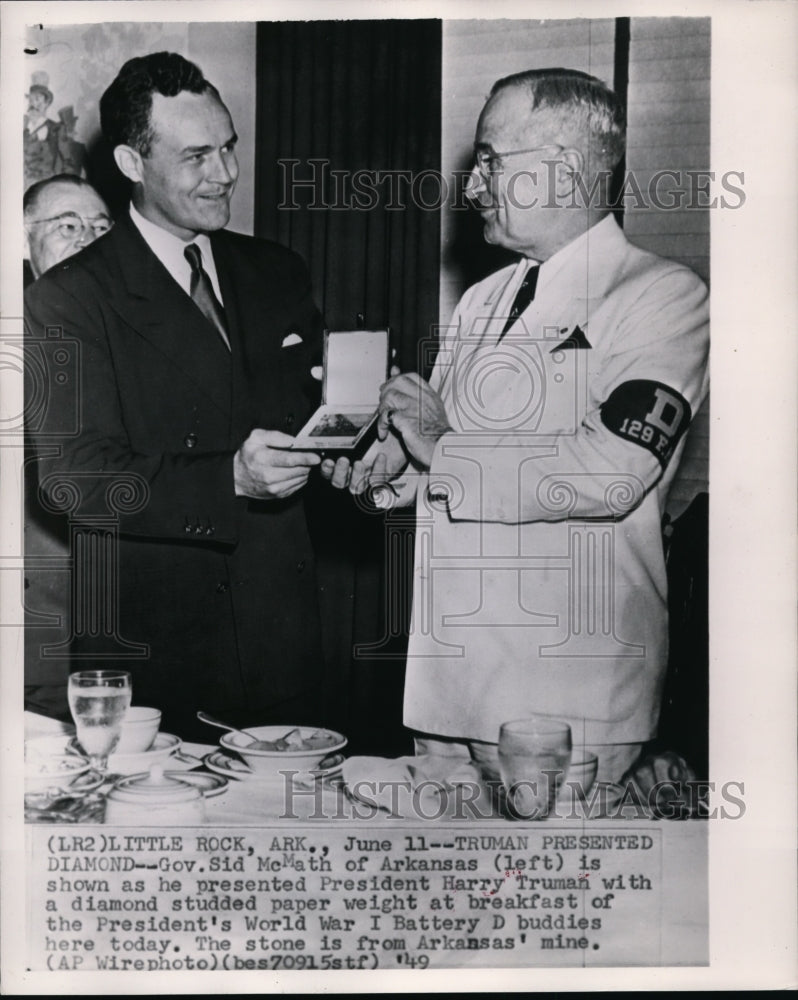 1949 Gov. Sid McMath presents President Harry Truman with a gift. - Historic Images