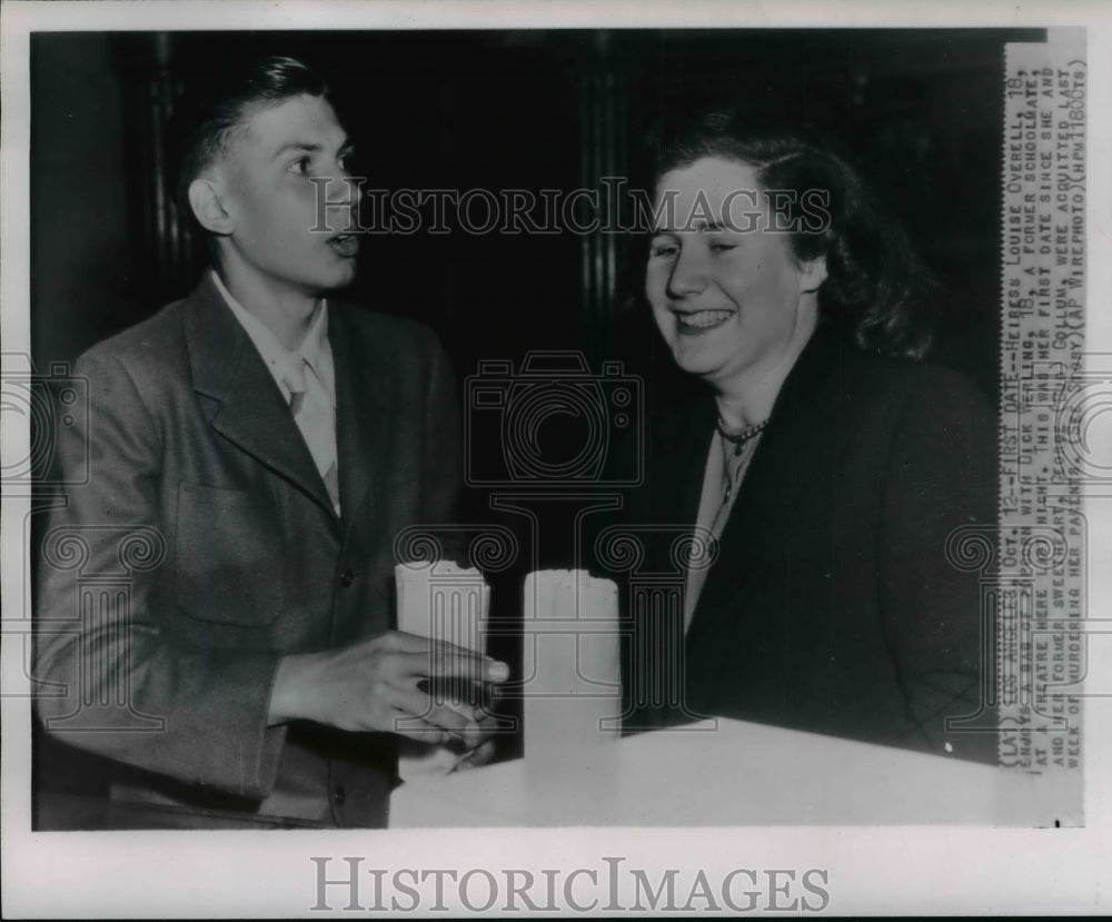 1947 Press Photo Heiress Louise Overel enjoys a bag of popcorn with Dick Werling - Historic Images