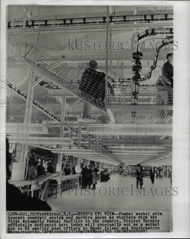 1960 Press Photo Postal worker surveys scene at the Automatic Postal facility - Historic Images