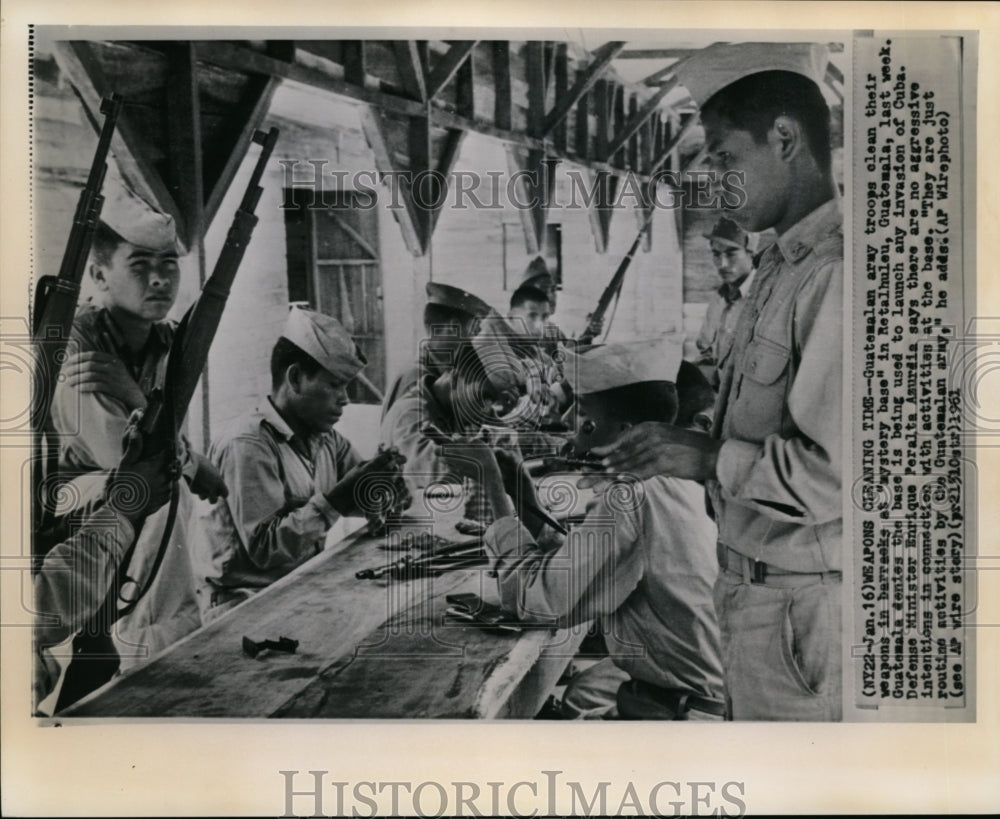 1961 Guatemalan troops clean weapons at barracks in Retalhuleu - Historic Images