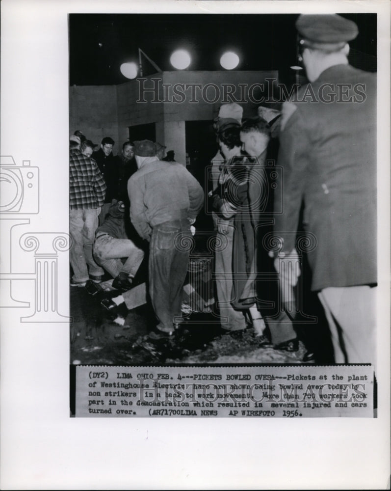 1956 Press Photo Strikes-Westinghouse Electric, Pickets Bowled Over. - cvw19288 - Historic Images