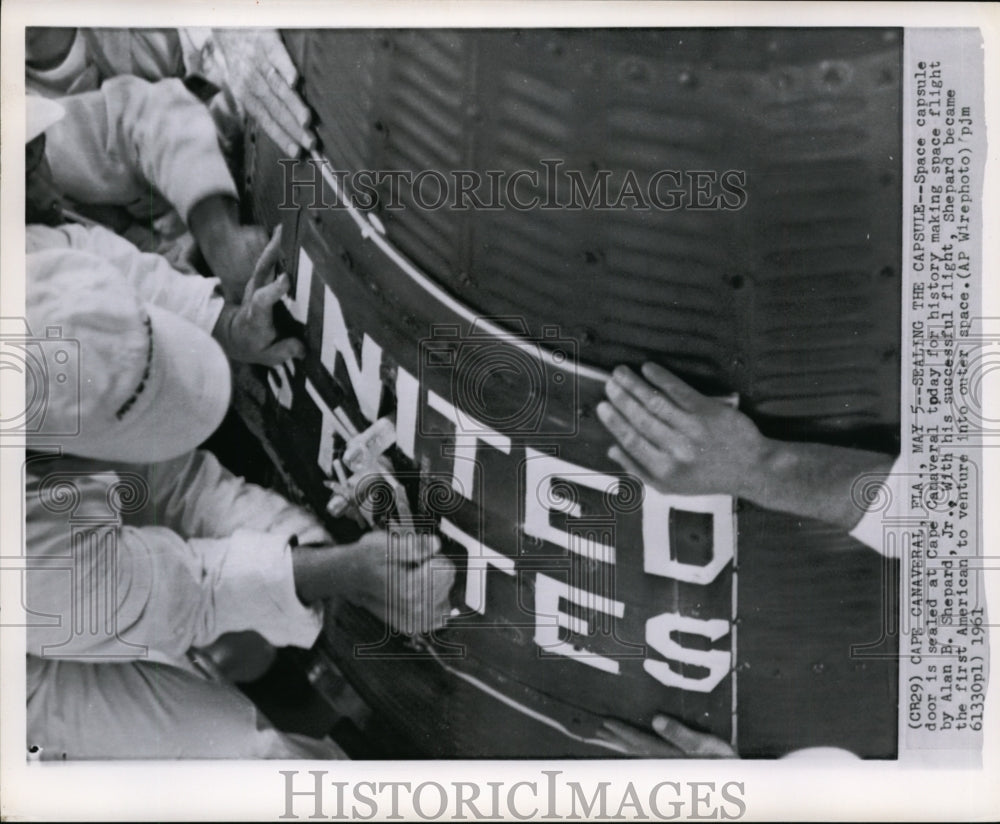 1961 Press Photo Workers sealing a Space capsule in Cape Canaveral, Fla. - Historic Images