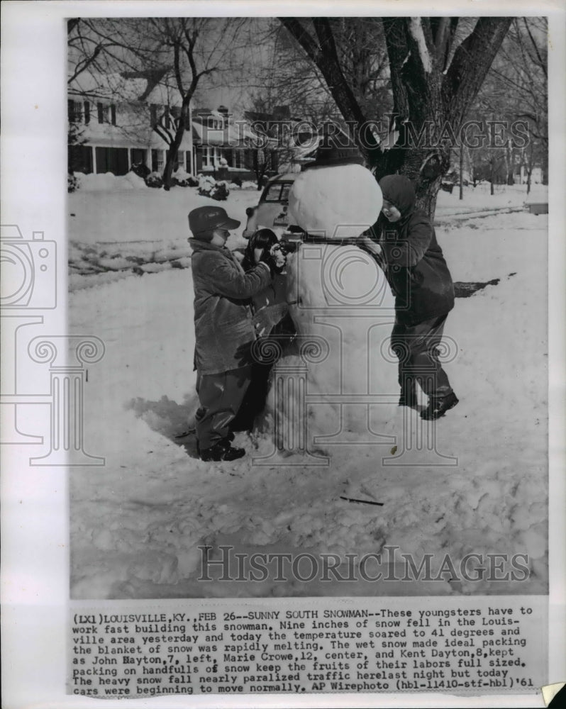 1961 John Dayton &amp; Marie Crowe building snowman in 9 inches of snow - Historic Images