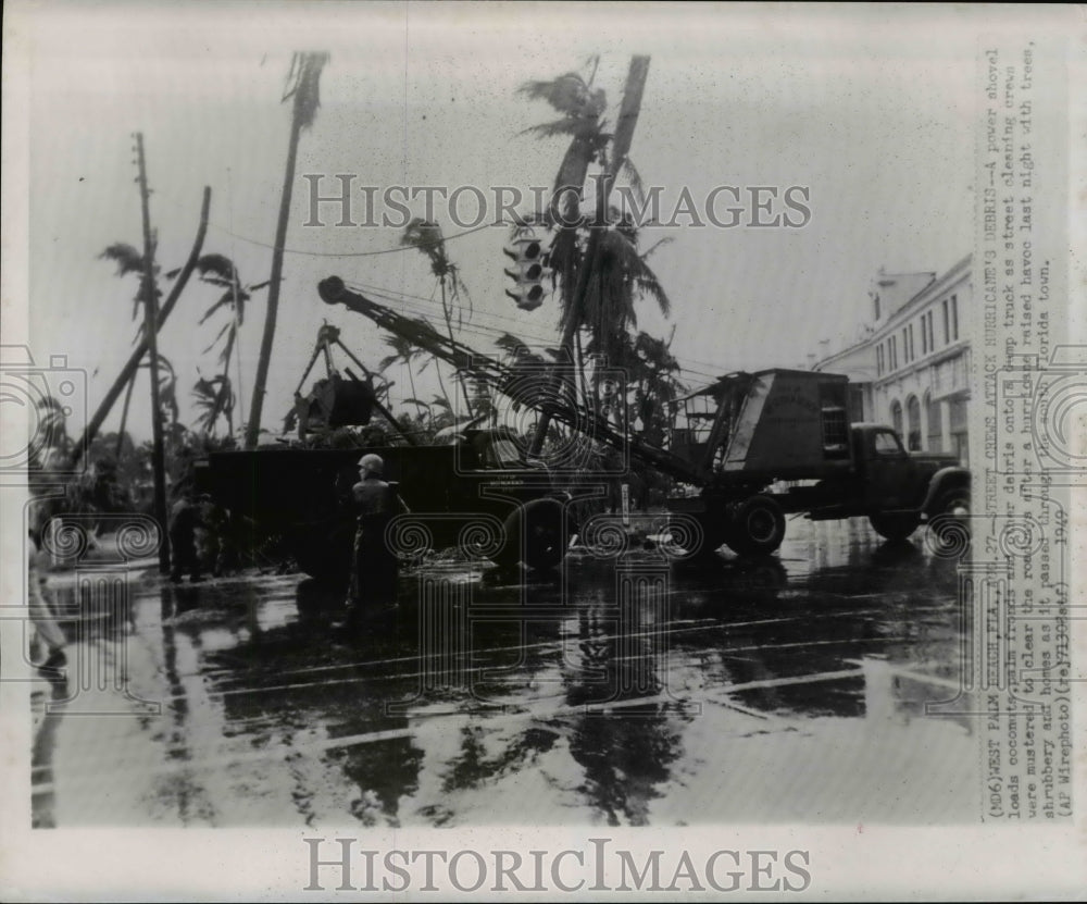 1949 Press Photo Shovel cleans up debris after hurricane devastated Florida - Historic Images