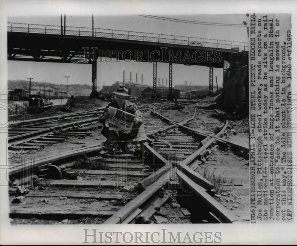 1952 Press Photo Joe Mullen, Pittsburgh Steel Worker, reads Nationwide strike- Historic Images