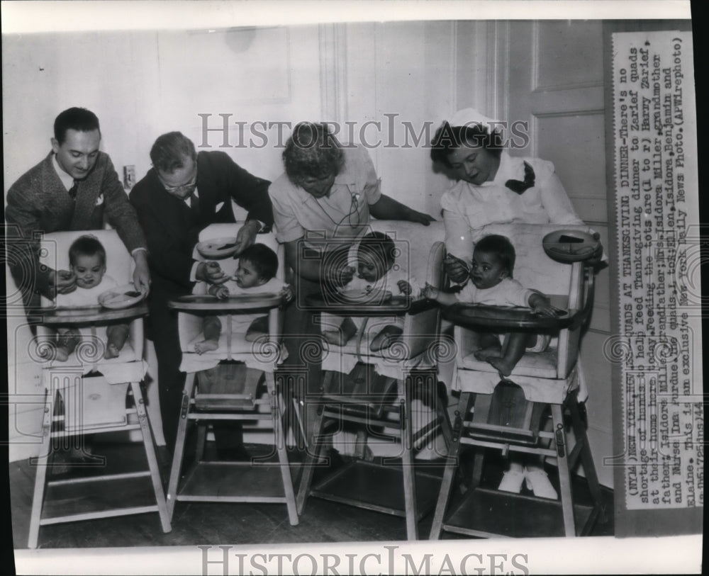 1944 Press Photo The Zarief quadruplets being fed Thanksgiving dinner at home - Historic Images