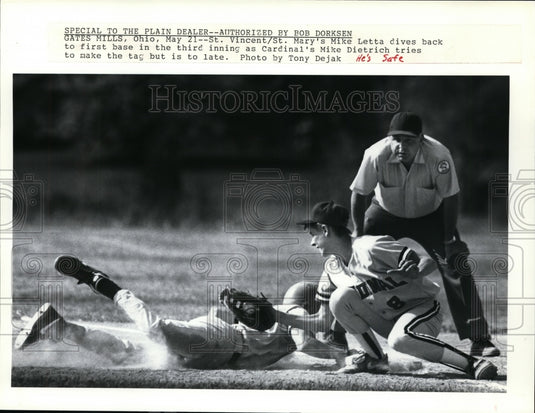 Press Photo St Vincent/St Mary's Mike Letta dives to first base in third inning - Historic Images