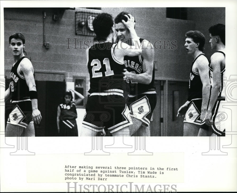 Press Photo Chris Stantz congratulated Tim Wade after three pointers vs Tuslaw - Historic Images