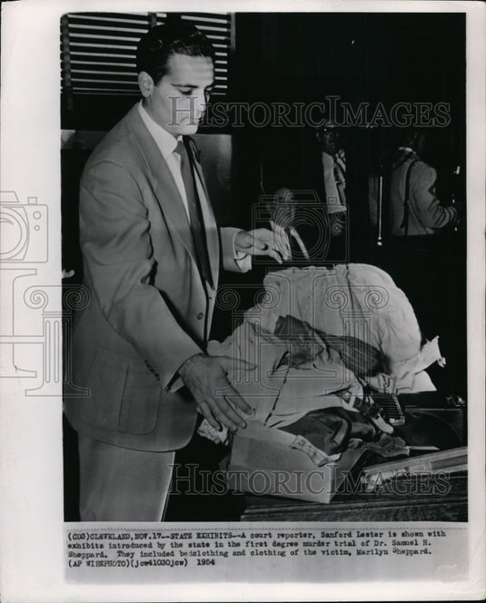 1954 Sanford Lester shown with exhibits for Dr. Sheppard's trial - Historic Images