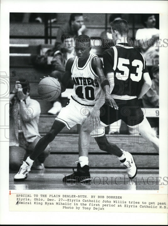 Press Photo John Willis tries to past Ryan Mihalic in first period at Elyria HS - Historic Images