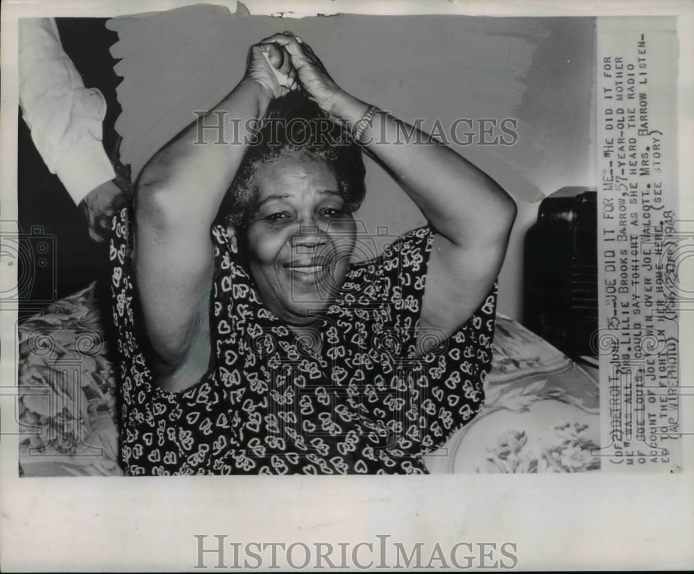 1948 Mrs. Barrow, mother of Joe Louis, listens to the fight at home - Historic Images