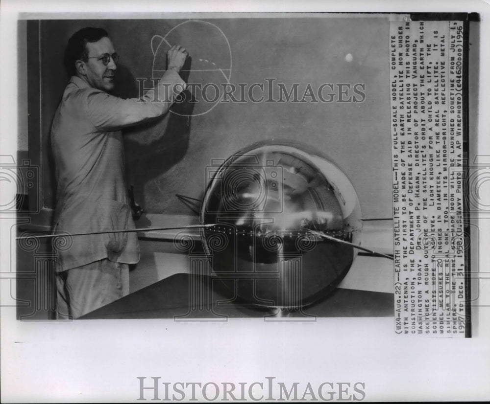 1956 Press Photo Vanguard director Dr. JP Hagan draws satellite's orbit outline - Historic Images