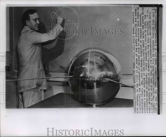 1956 Press Photo Vanguard director Dr. JP Hagan draws satellite's orbit outline - Historic Images