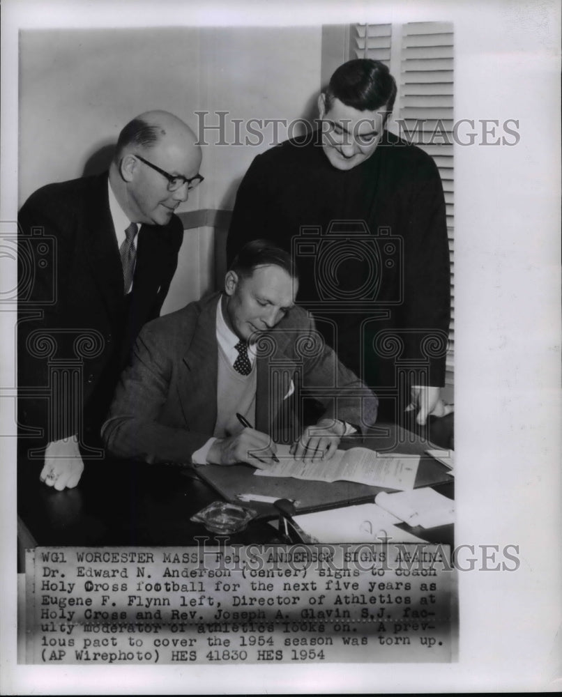 1954 Dr Edward N Anderson signs to coach Holy Cross Football-Historic Images