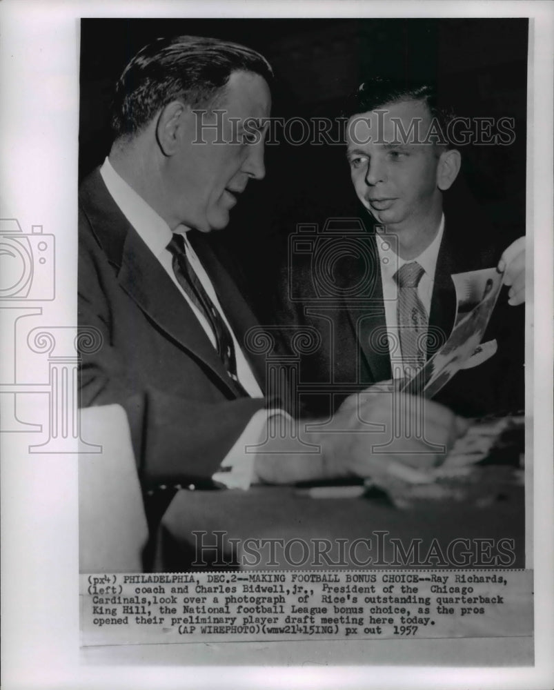1957 Coach Richards &amp; Charles Bidell Jr look at photo of King Hill - Historic Images