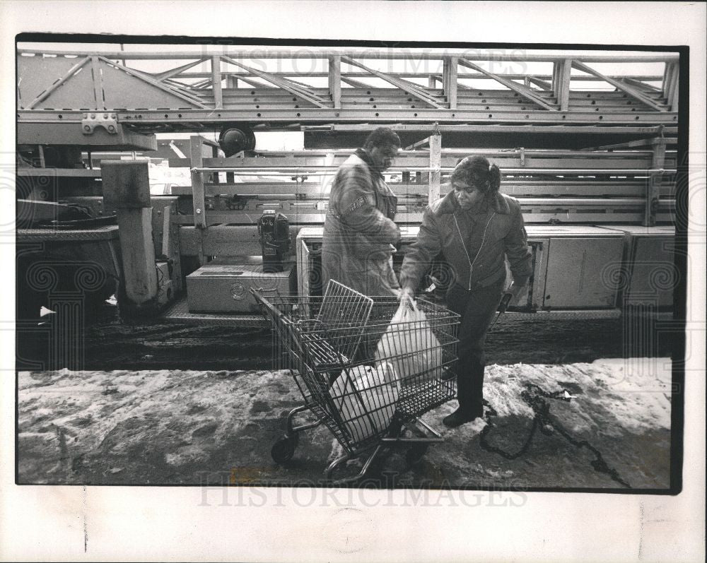 1990 Press Photo Smith Donald Bynum load supplies truck - Historic Images