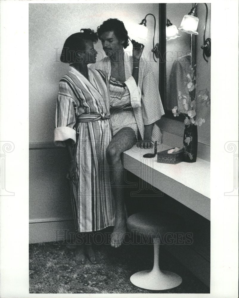 1983 Press Photo Ads barely use scantly dressed male. - Historic Images