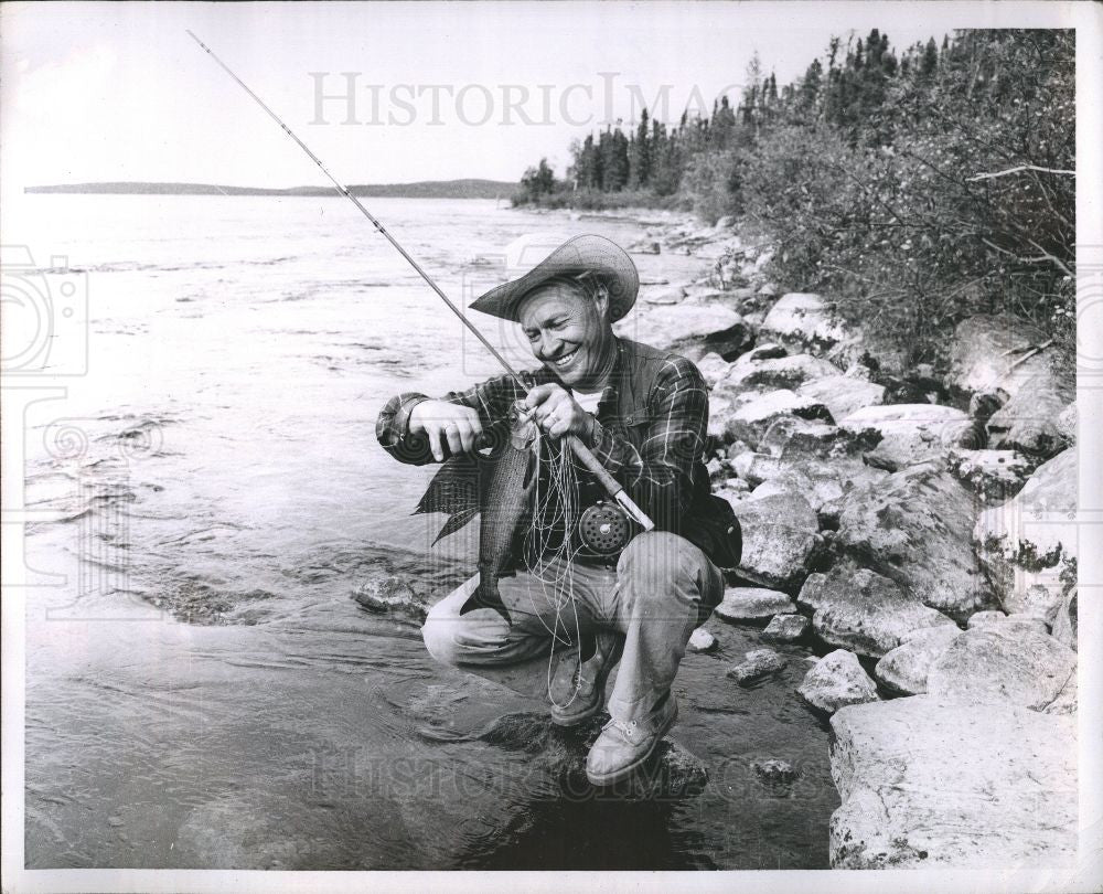Press Photo Fisherman Catches Large Trout - Historic Images