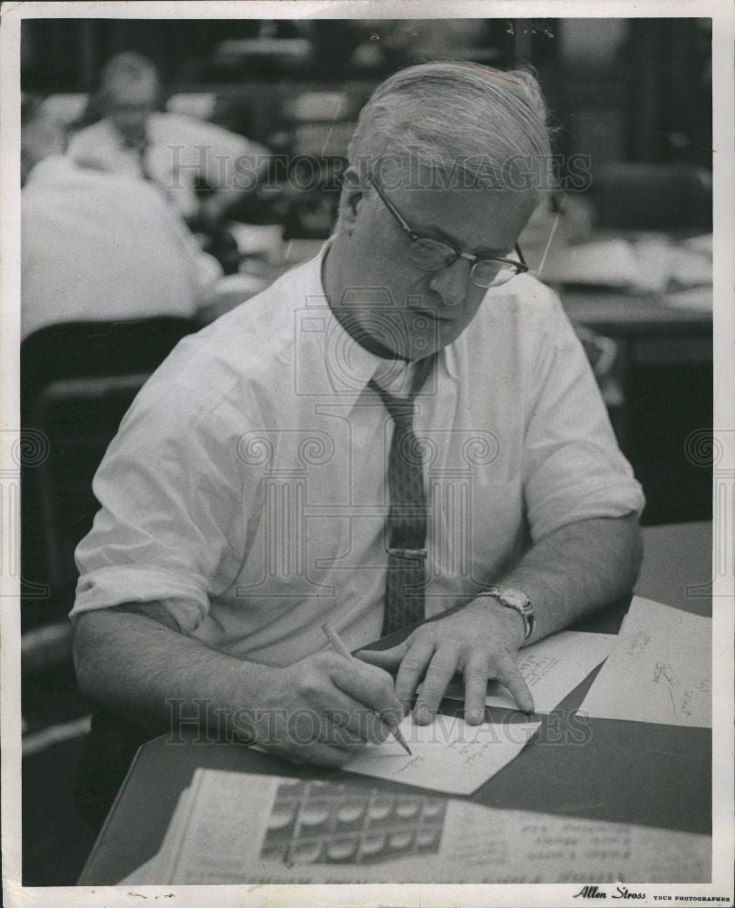 1961 Press Photo man working desk pencil - Historic Images