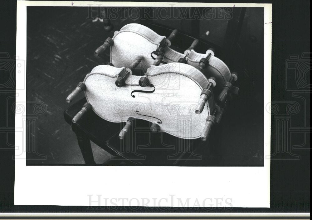 1988 Press Photo violin bodies clamped together to dry - Historic Images